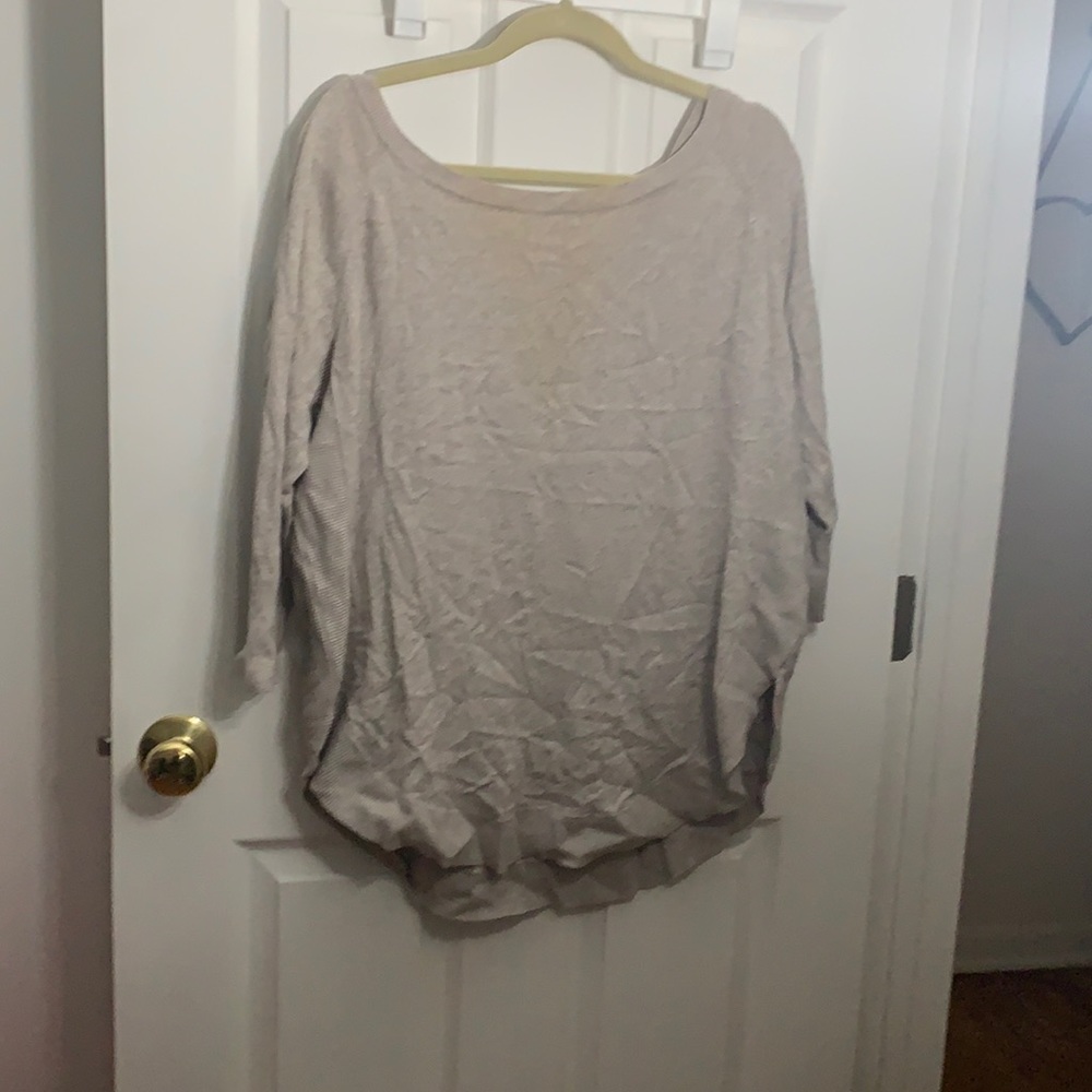 Tan size large tunic sweater with criss cross in the back